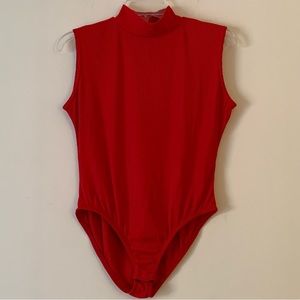 JONDEN. Red sleeveless bodysuit. Buttons on bottom. Turtle neck. Button …